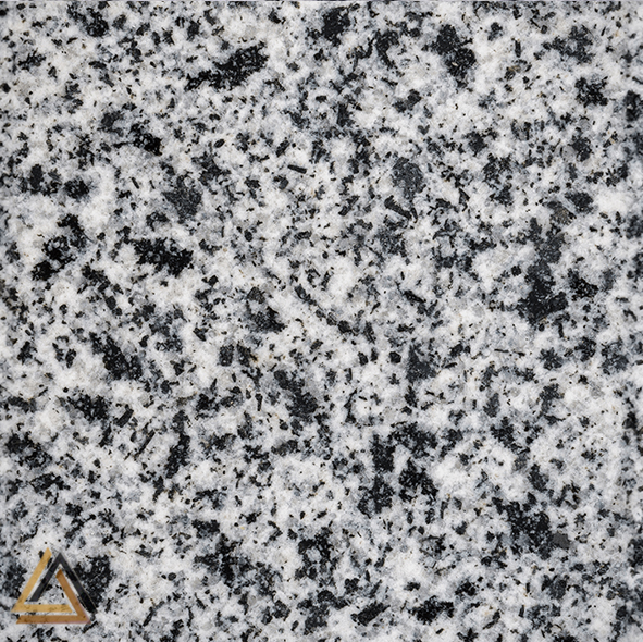 New Halayeb Granite is an Egyptian natural stone with a dark grey to nearly black base and fine mineral grains. Ideal for flooring, countertops, wall cladding, and outdoor applications.